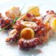 Polpo con patate al forno | Ricetta
