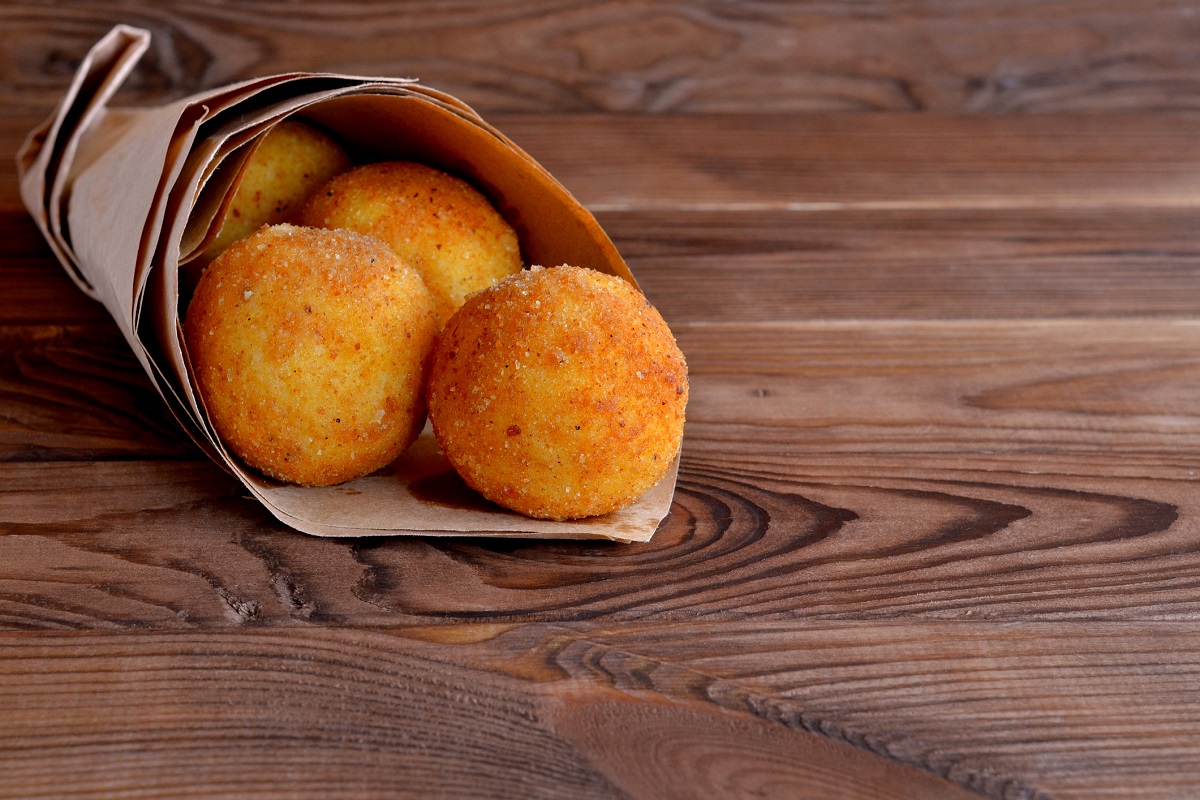 Come fare gli arancini con zucca e speck con la ricetta siciliana